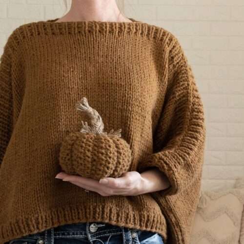 hand knit seed stitch pumpkin with a braided stem
