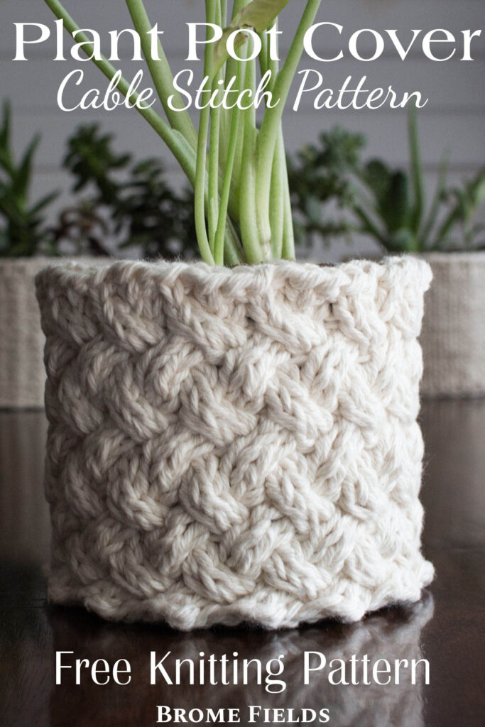 pic of a cable stitch knitted plant pot holder covering a pot with a plant in it