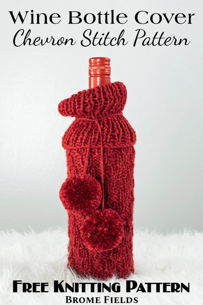 chevron knitted wine bottle cover with pom-poms displayed on a wine bottle.