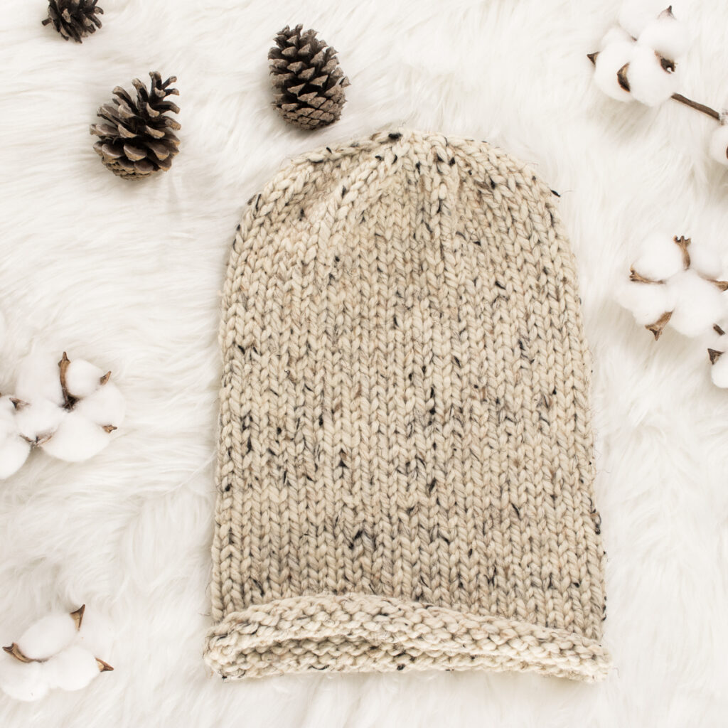 easy knit hat displayed on faux fur blanket