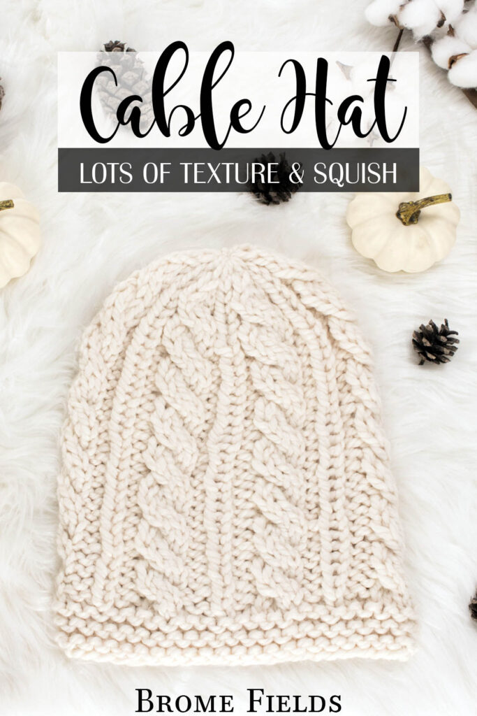 cable knit hat displayed on faux fur blanket