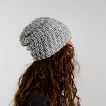 model wearing a simple chunky knitted beanie hat
