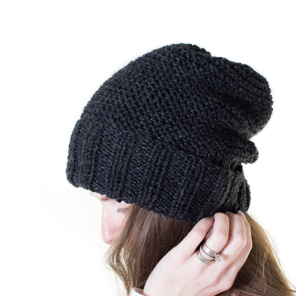 model wearing an easy knitted hat using 2 needles