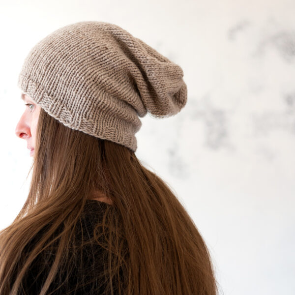 model wearing a simple slouchy knitted hat
