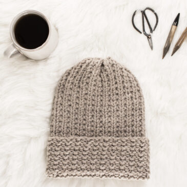 woolly knit hat displayed on faux fur blanket