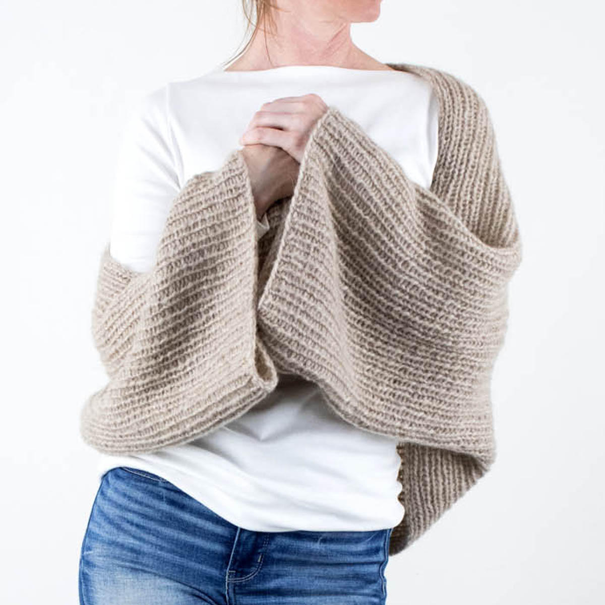 model wearing an easy Oversized Crop Shrug Sweater knitted in the rib stitch